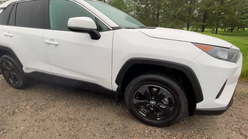 black rims on white car